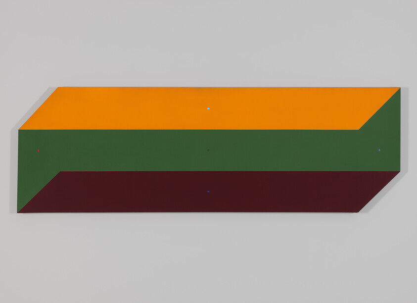 Long rectangular wall sculpture with orange top, green middle, and dark red bottom bands.