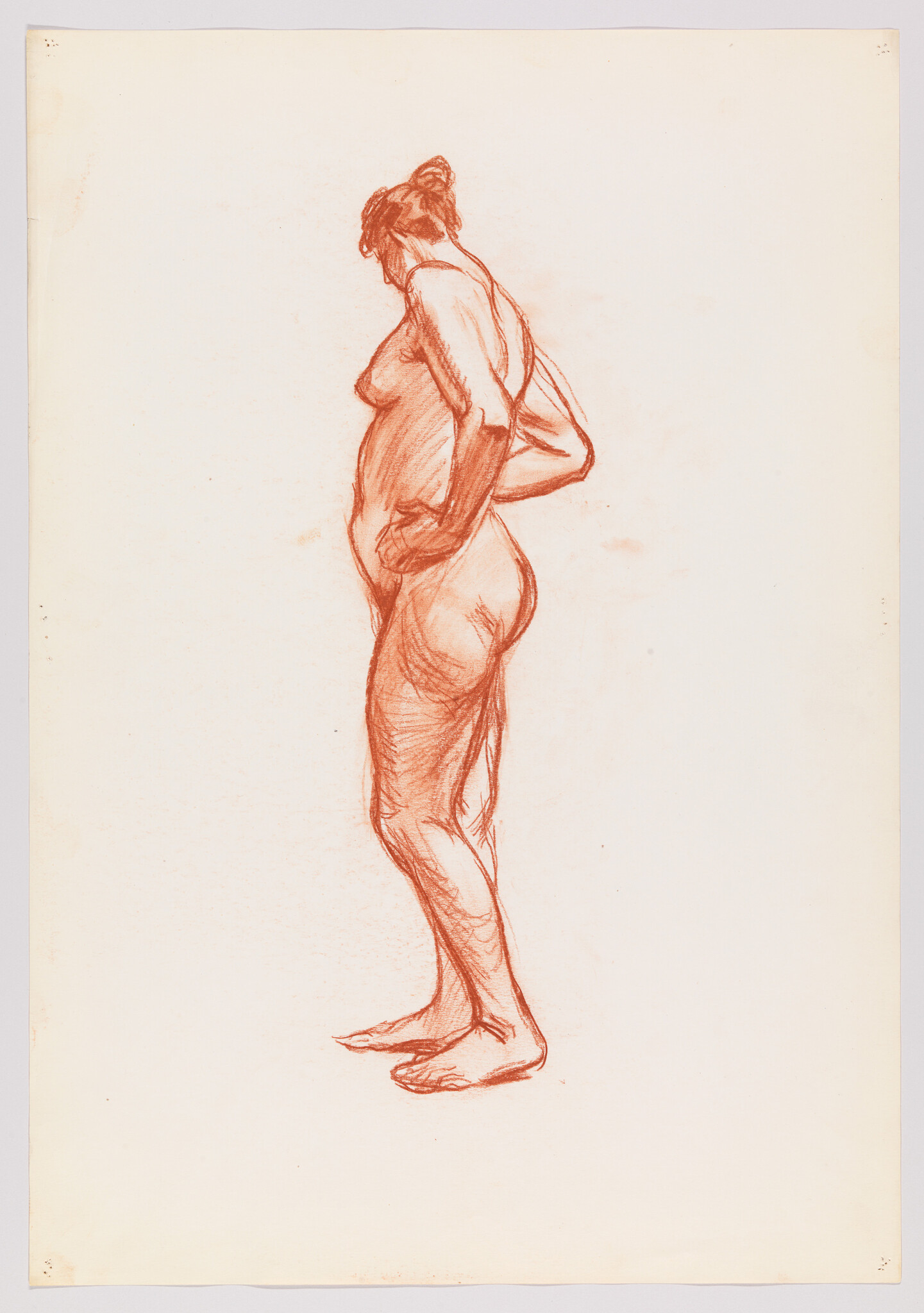 Standing nude woman in a red chalk sketch with hands on her hips and head turned down.