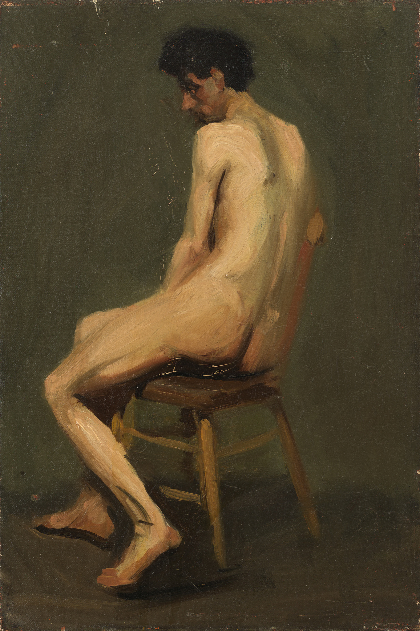 A nude male with curly black hair sits in a wooden chair, his body turned slight away from us