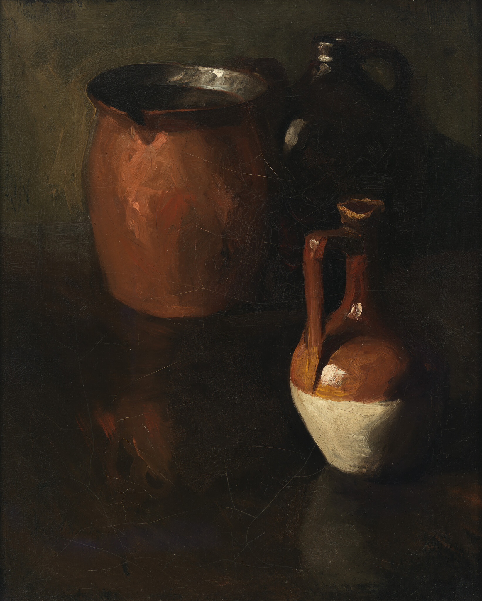 Two clay vessels, a large brown pot and a brown-and-white pitcher, sit on a dark surface.