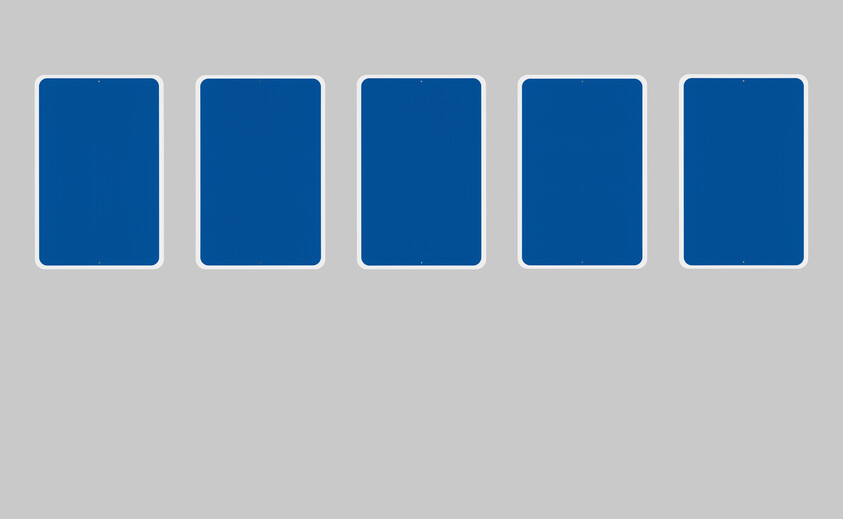 A series of five blank blue rectangular signs each with a thin white border, reminiscent of accessibility signage