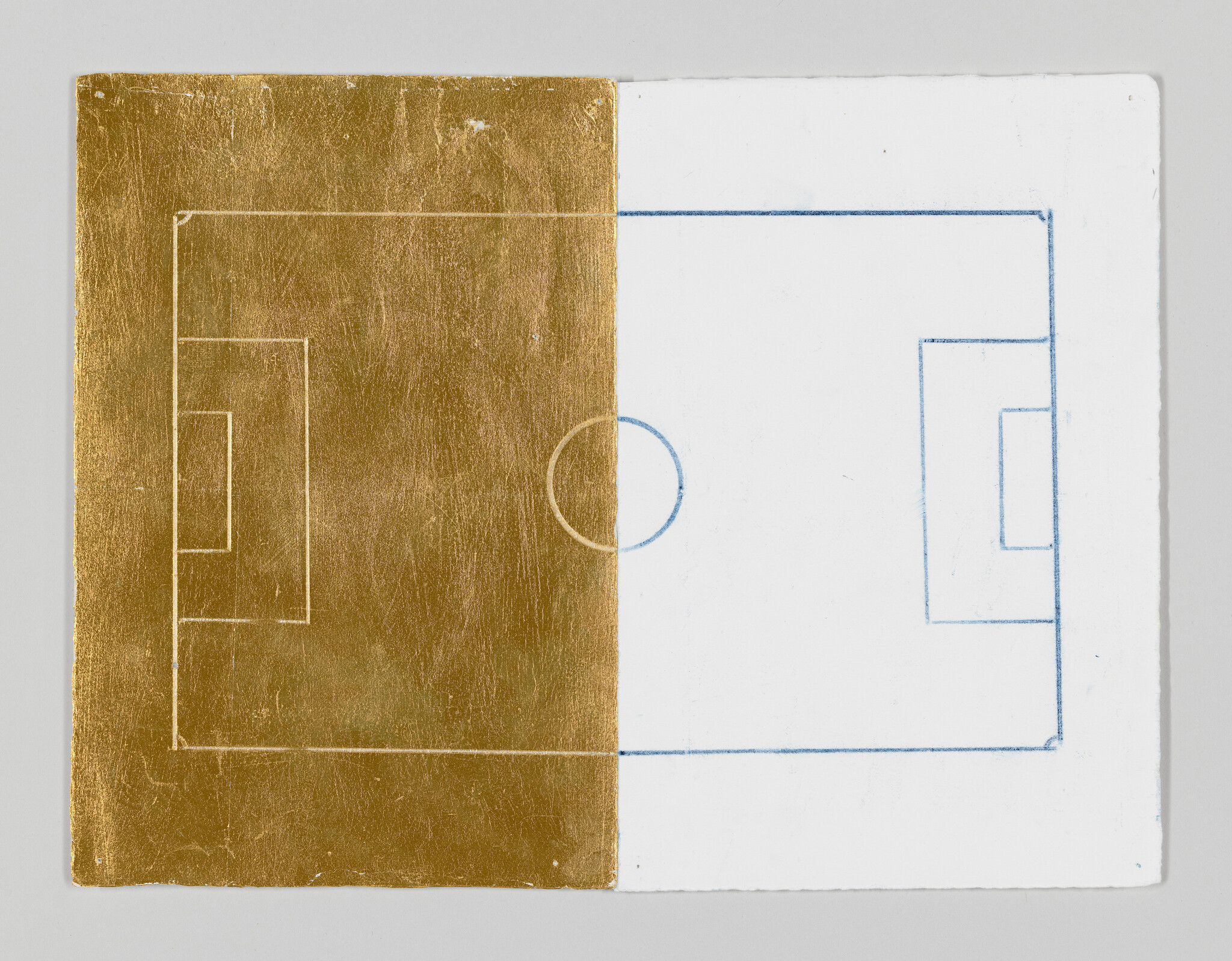 Half gold leaf and half white paper showing a simple soccer field drawing split down the center.