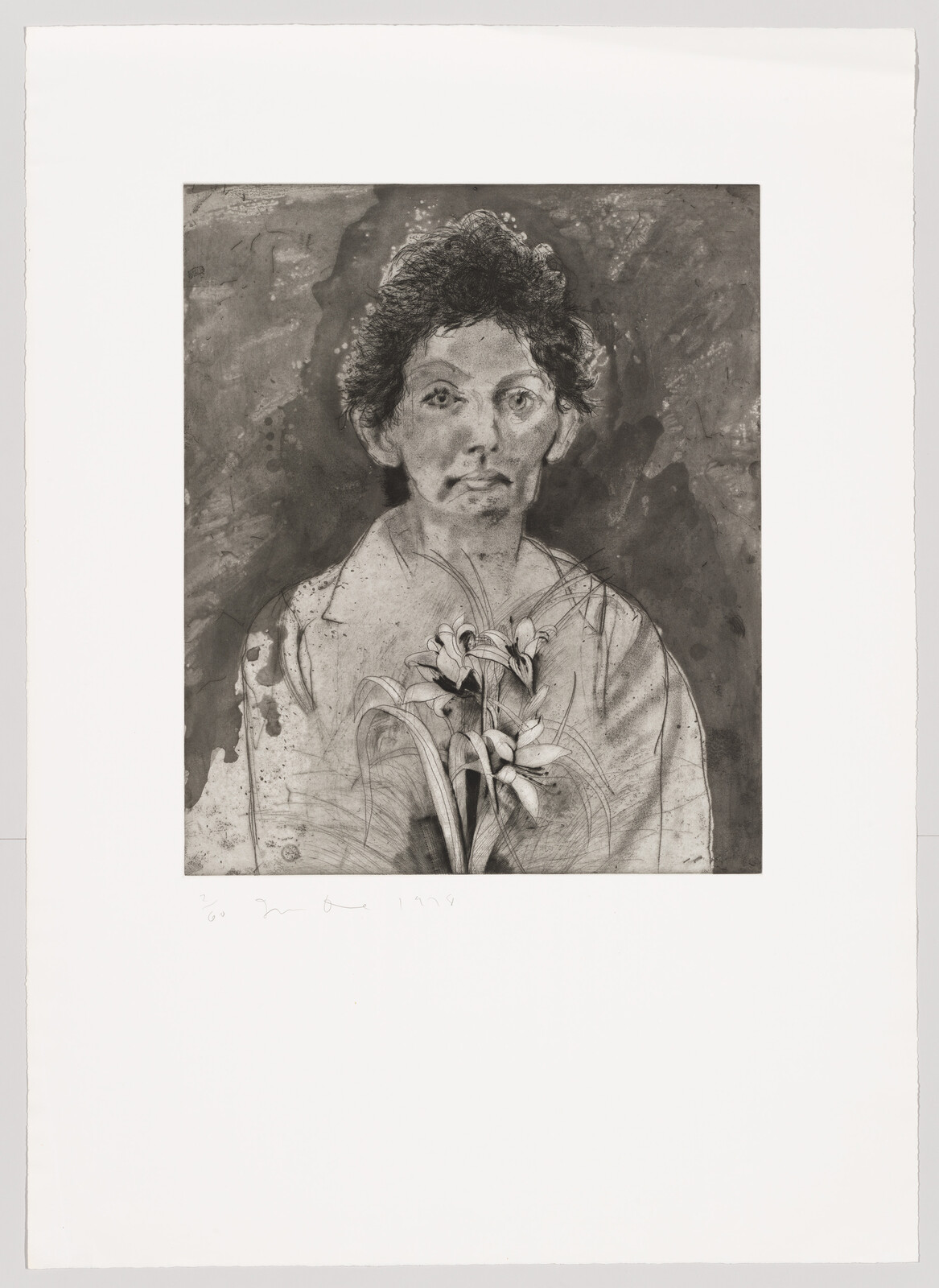 A somber young person in a shirt holds a bouquet of lilies at chest.