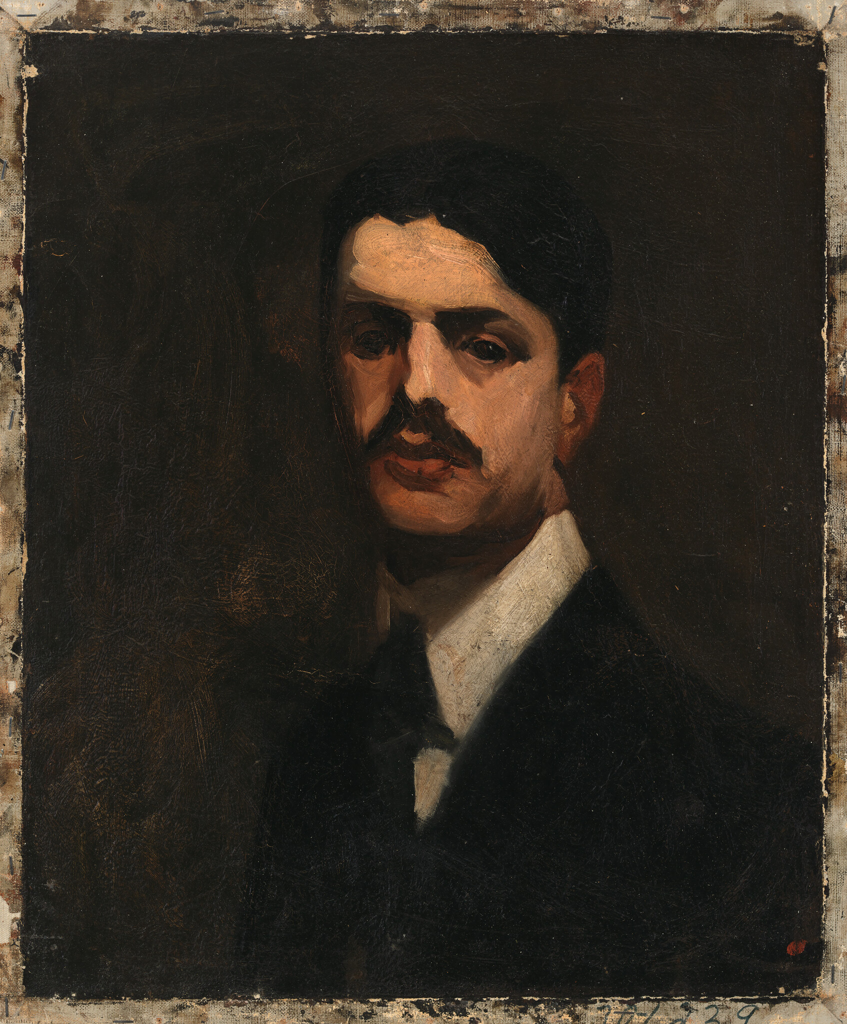 A formal portrait of a man with a mustache wearing a dark suit and white collar.