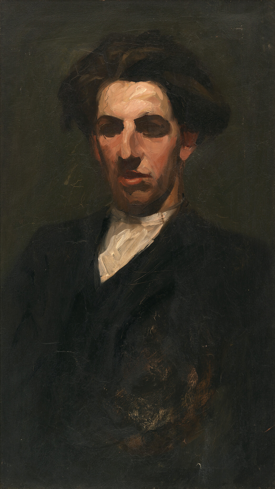 A dark-toned portrait of a young man wearing a white collar and dark jacket, looking downward.