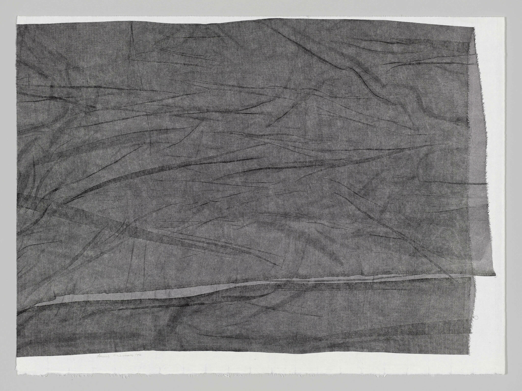 A grayscale image of a textured fabric with intricate folds and creases, giving the appearance of a crumpled piece of cloth. The fabric is framed against a white background, and there is a signature with a date at the bottom left corner.