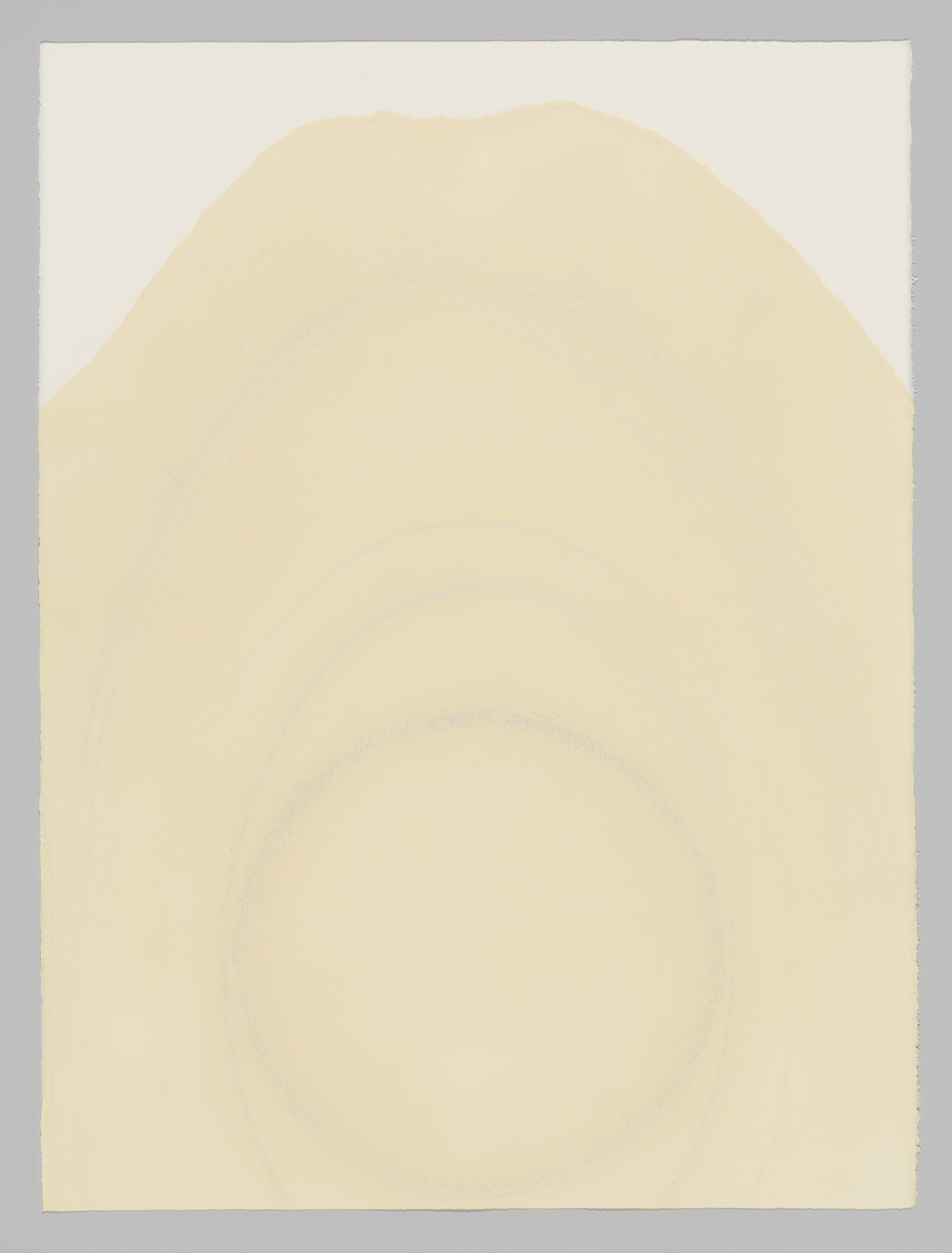 A minimalist artwork featuring concentric circles in a pale, yellowish hue set against a cream-colored background. The circles are faint and appear to be hand-drawn, with the largest circle near the top edge of the canvas, creating a sense of depth or a topographical map. The image has a textured appearance, with the edges of the paper slightly irregular and the colors softly blending into the background.