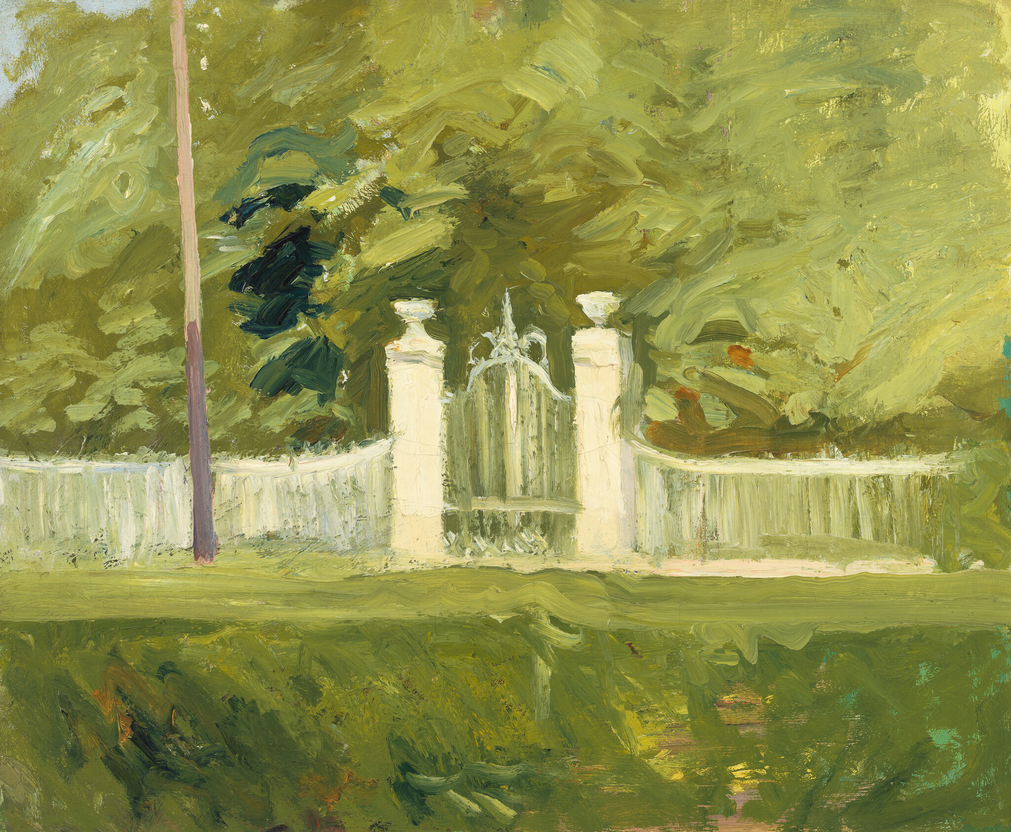 A white wrought-iron gate set between stone pillars in front of dense green trees.