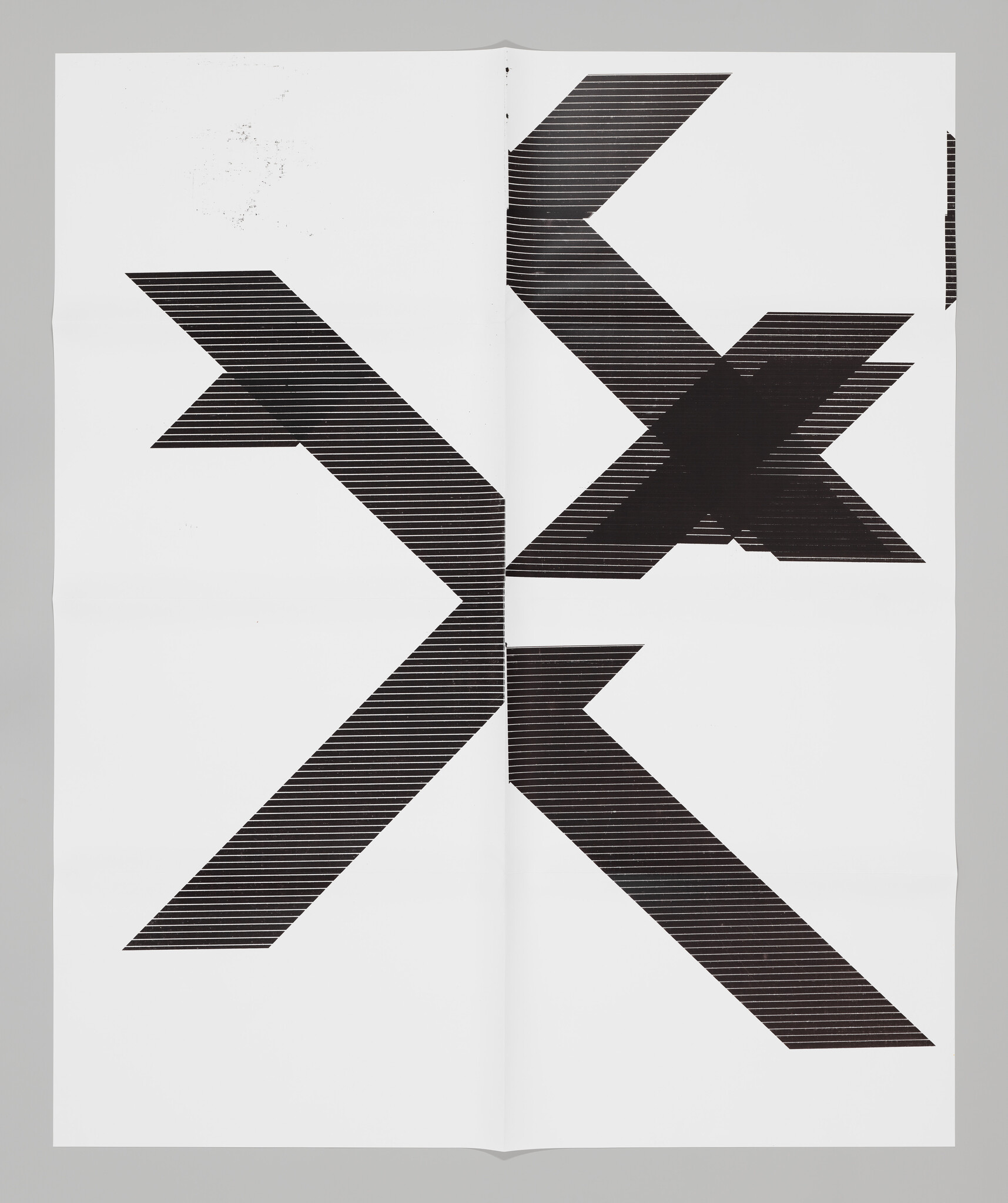 Fragments of black letters "X" scattered across white background.