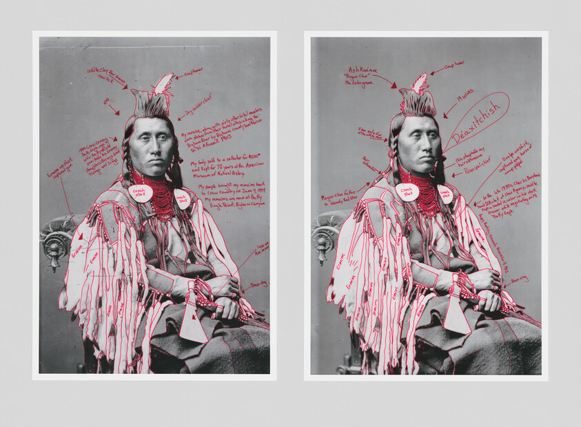 Seated man in traditional clothing with red handwritten annotations and drawn outlines over his outfit.