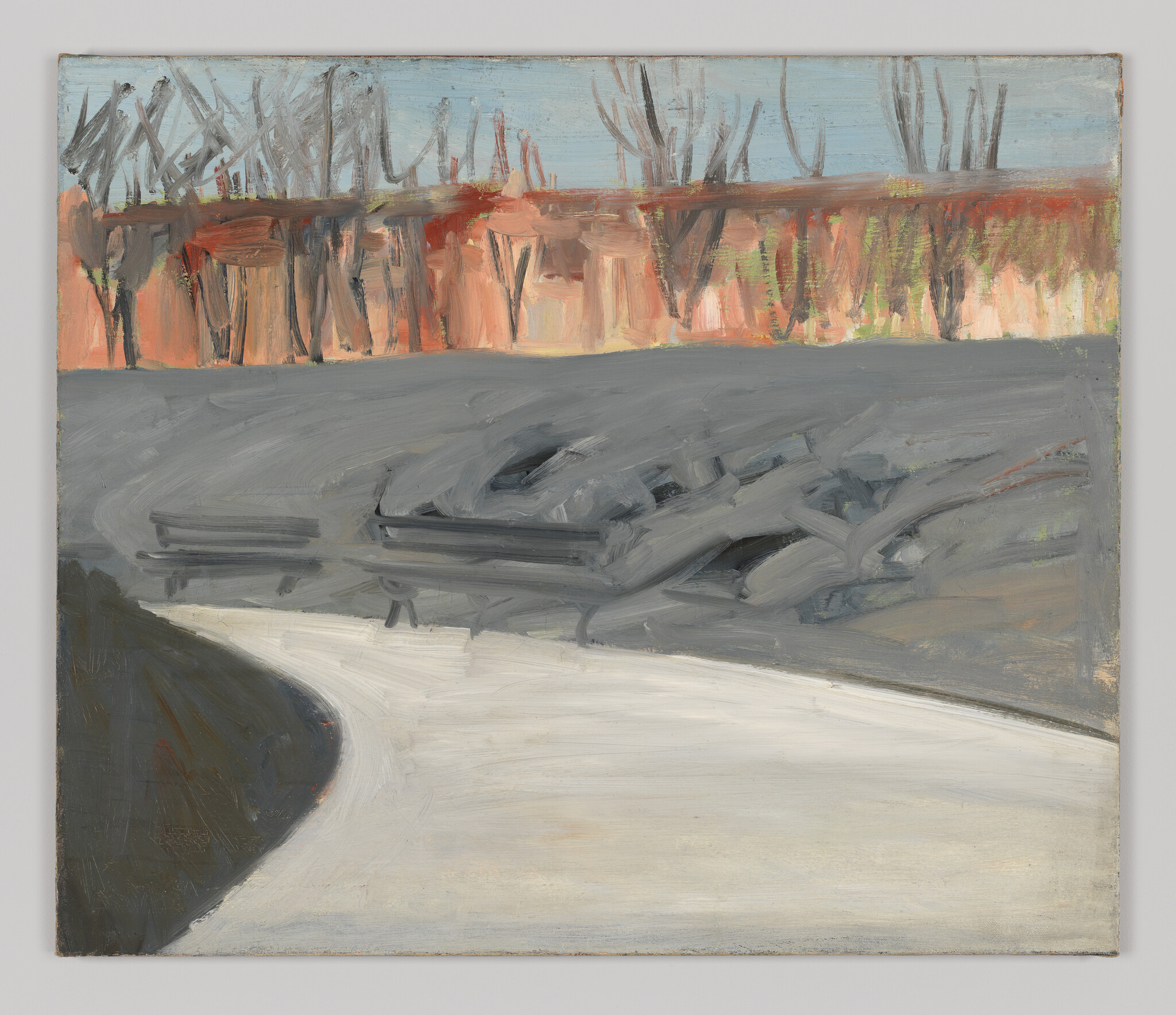 A curved pale path leads past gray benches and a distant line of leafless trees.