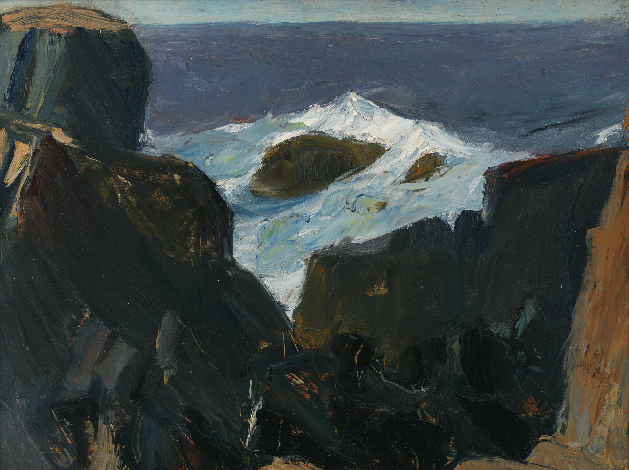 Dark coastal cliffs with white surf crashing into a narrow rocky inlet beneath a gray sea.