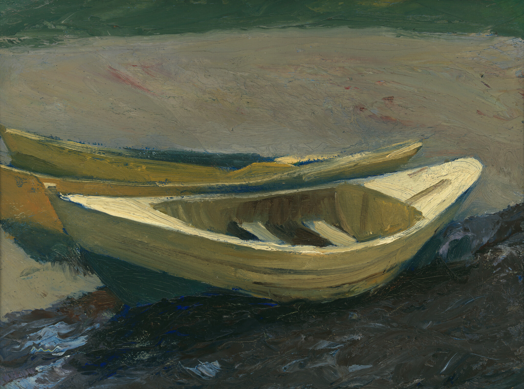 Two small wooden rowboats resting on a dark sandy shore under a cloudy sky.