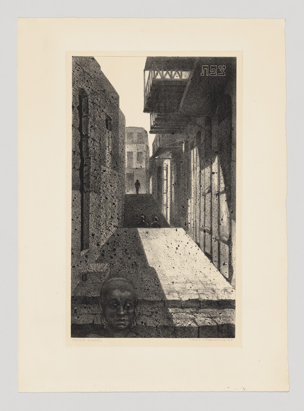 A narrow sunlit alley between stone buildings with a distant walking figure and a sculpted head.