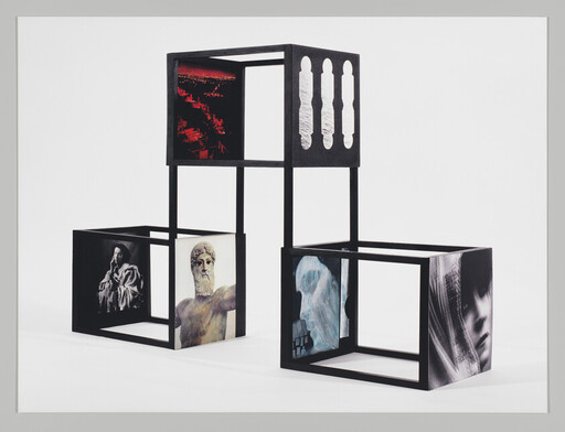 Three black open cube frames stacked and arranged, each panel showing different portraits and scenes.