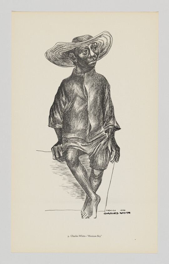 A barefoot Mexican boy in a wide-brimmed hat sits on a ledge holding a thin stick.
