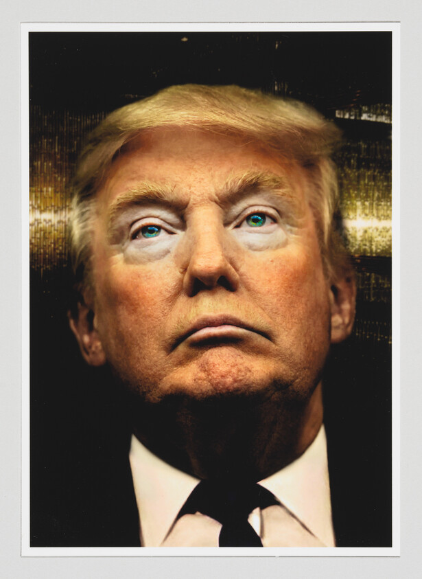 Close-up portrait of an older man with blond hair and a stern expression.