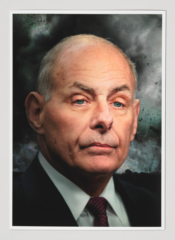 Older man in suit and tie with a serious expression looking slightly to the side.