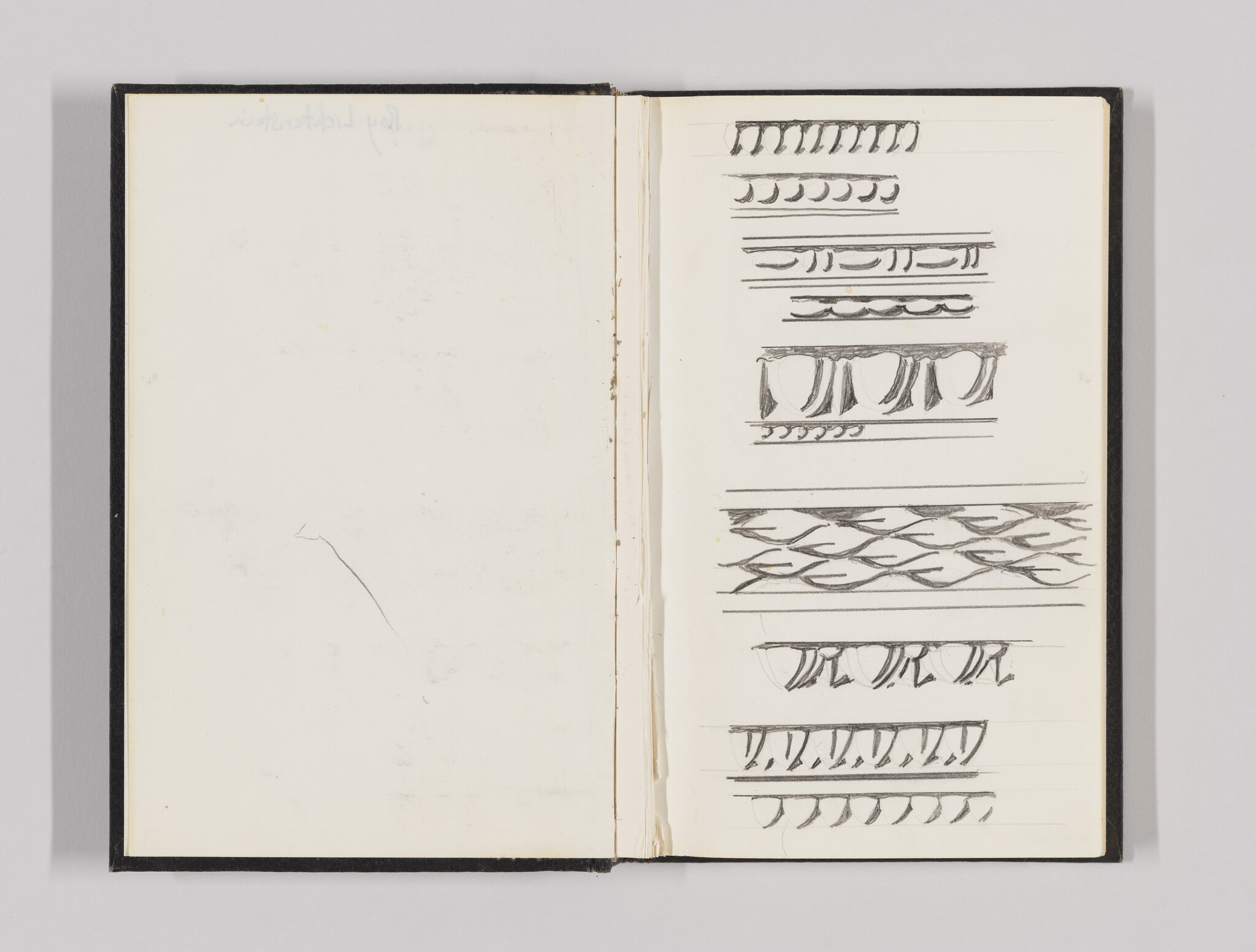 Open sketchbook showing pencil studies of repeating ornamental border patterns on the right page.