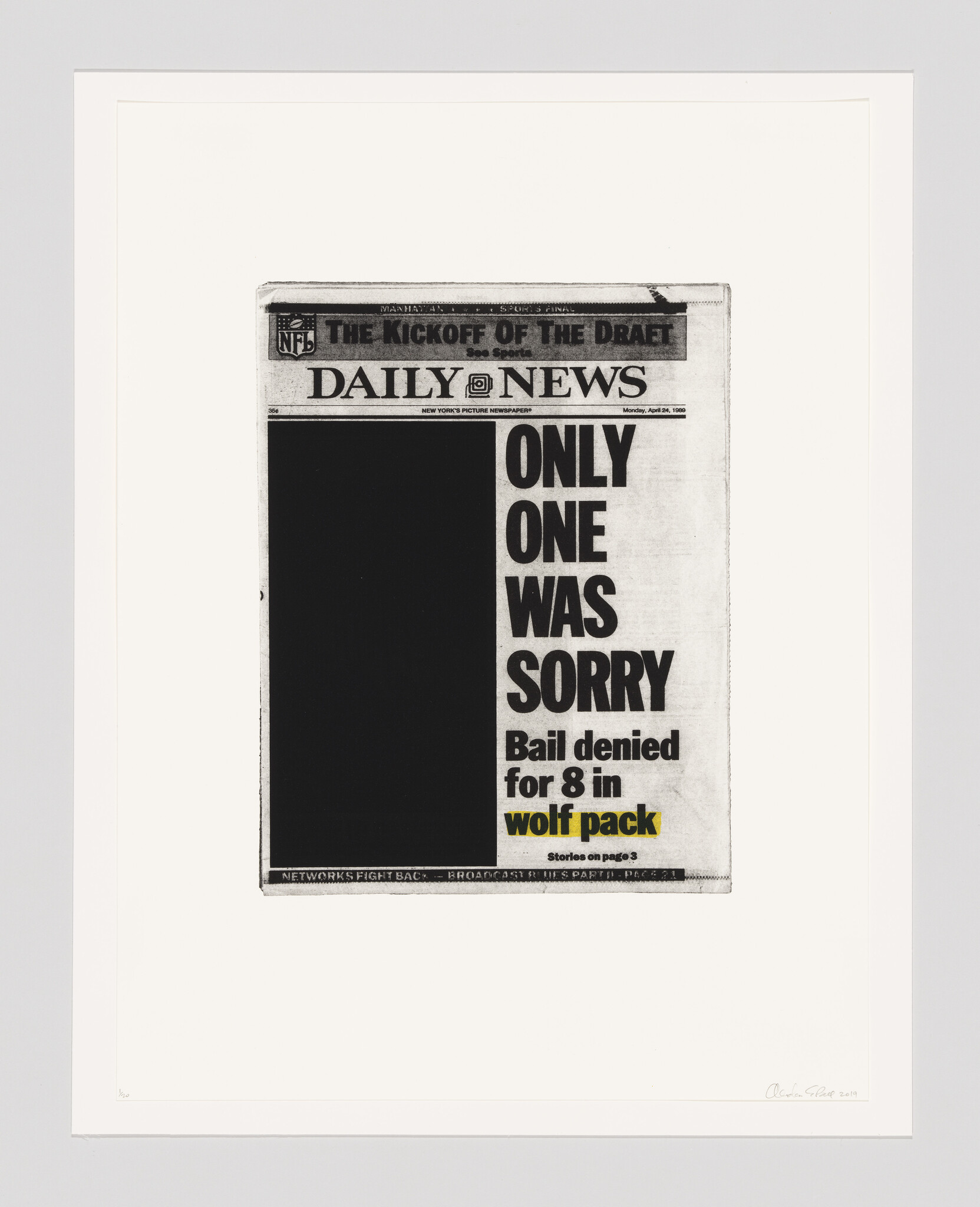 Framed newspaper front page with bold headline about bail denied for eight in wolf pack case.