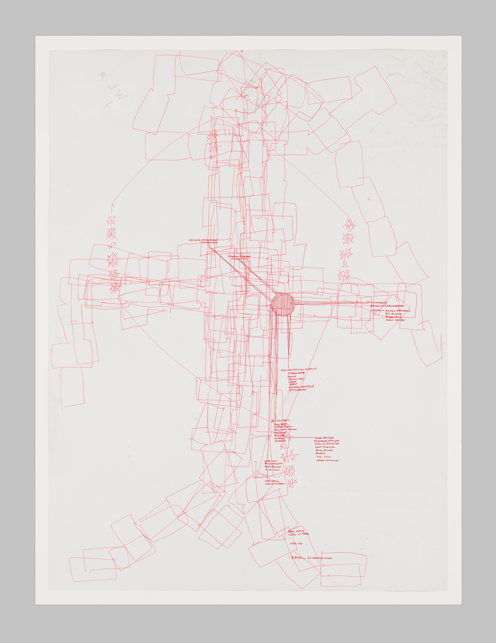 Red schematic drawing of a cross-like structure with overlapping rectangles and handwritten labels.