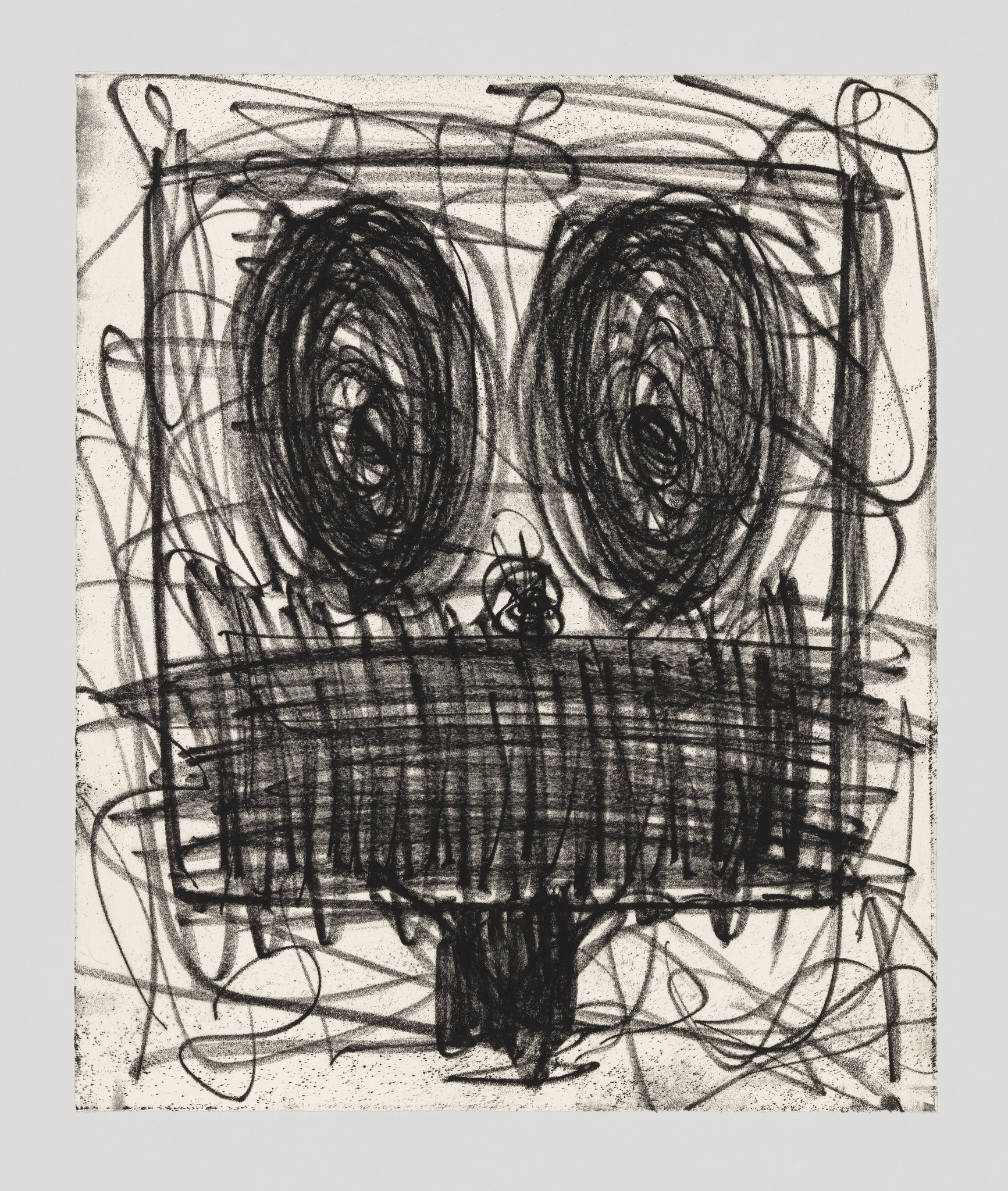 A face with big dark swirls for eyes, and chaotic, scribble-like patterns depicting the mouth.