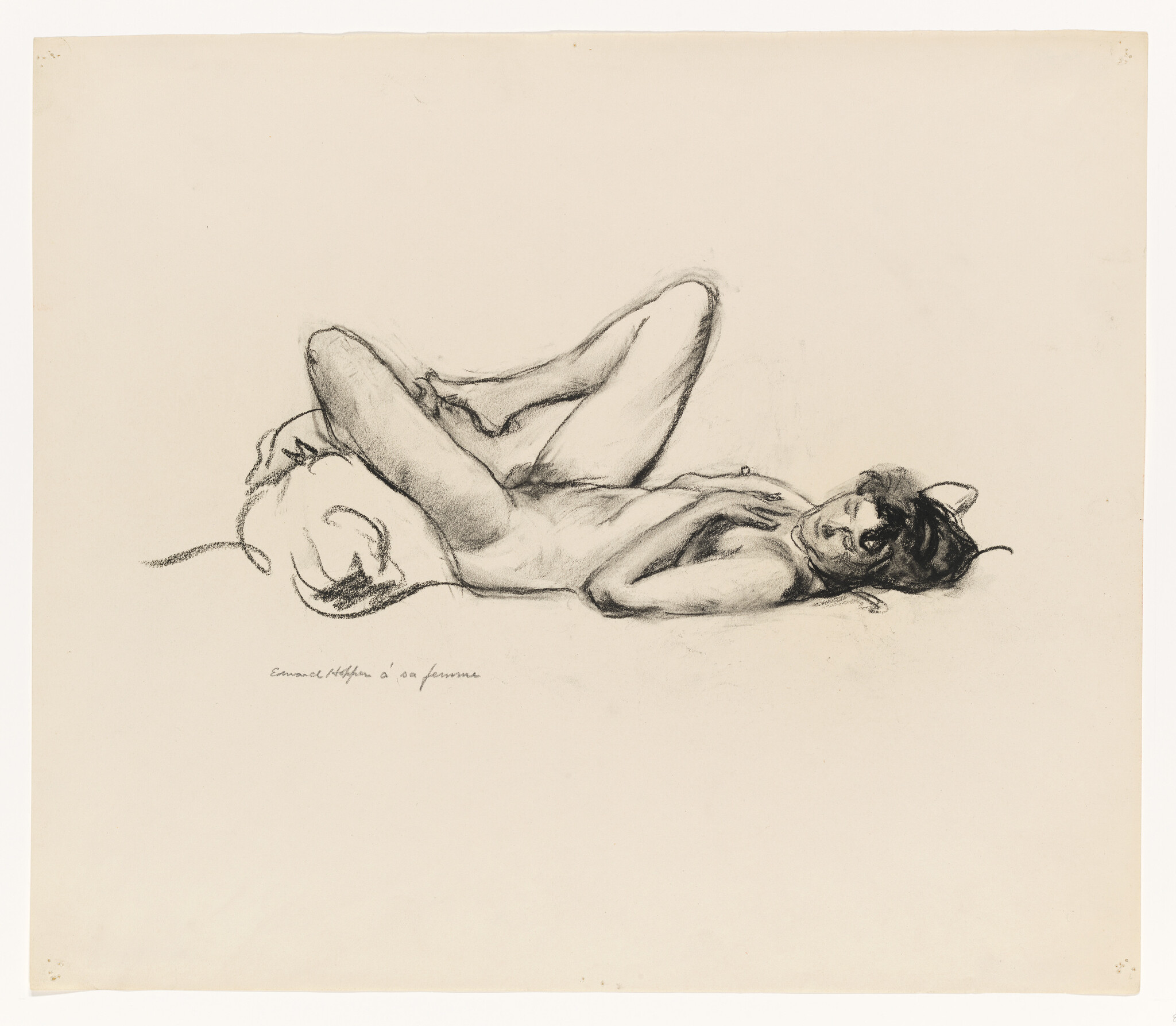 A nude woman lies reclined on a pillow with legs bent, looking toward the viewer.