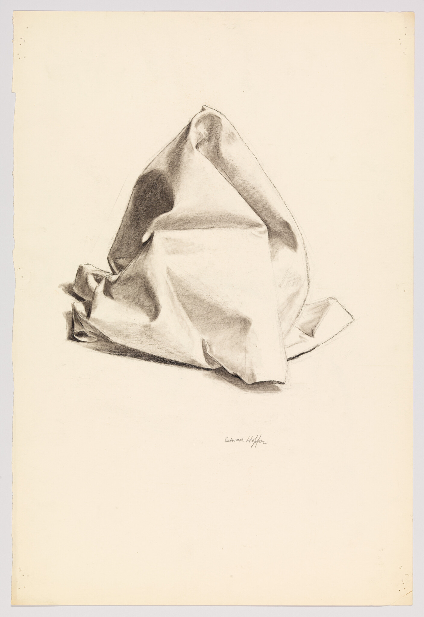 A charcoal drawing of a folded, draped piece of cloth with strong light and shadow.