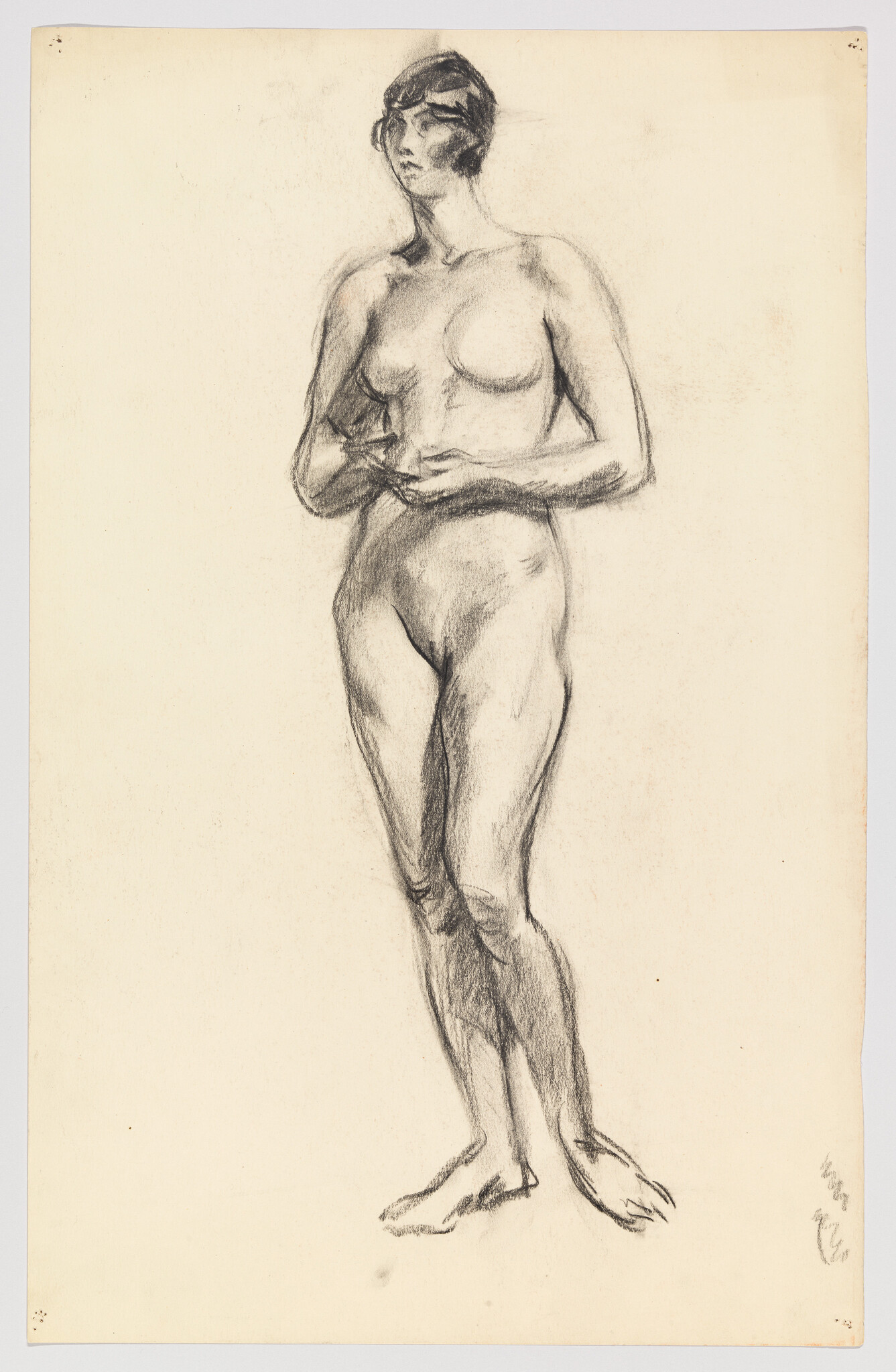 Standing nude woman drawn in charcoal with hands clasped at her waist.