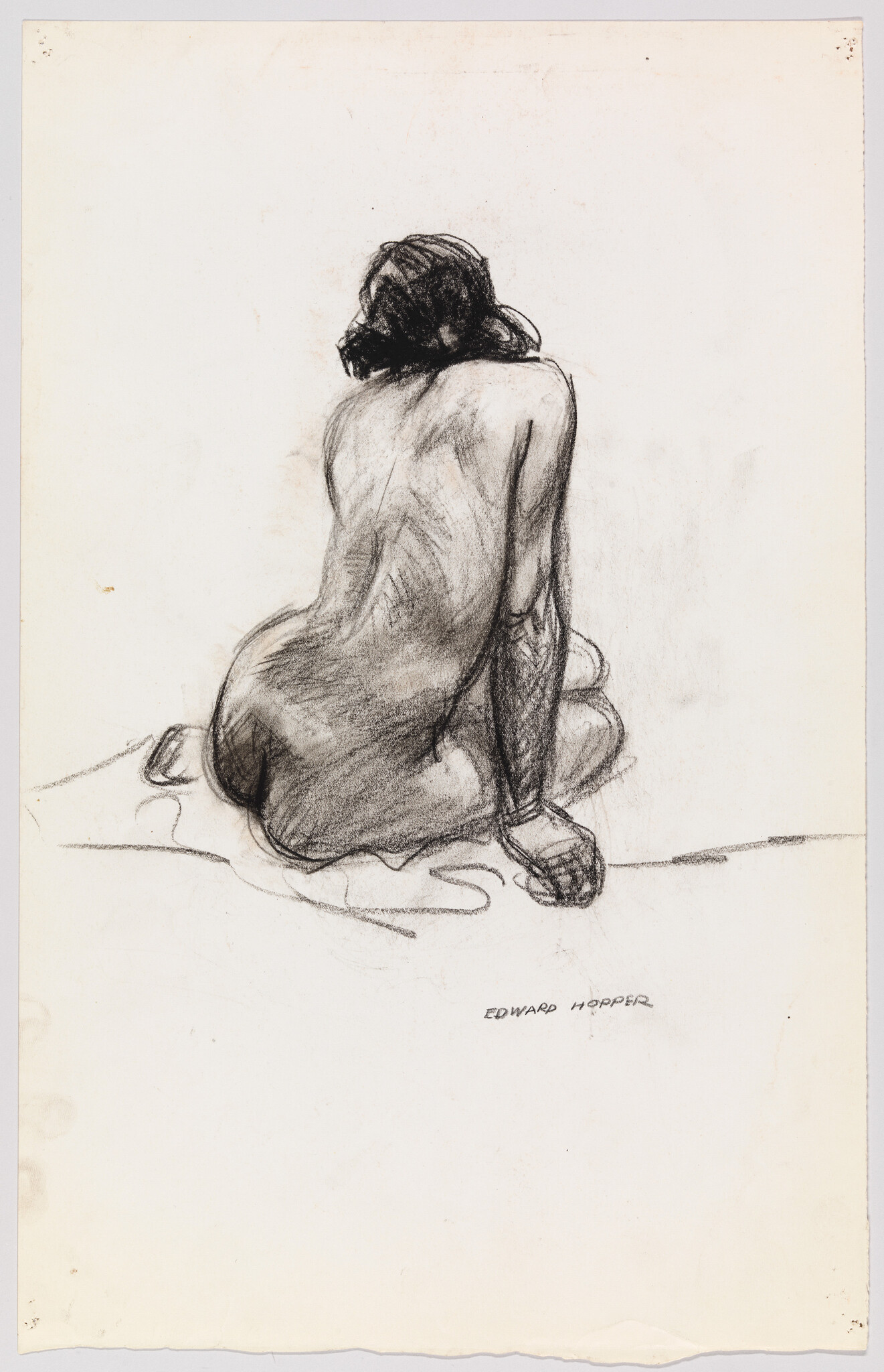 A charcoal sketch of a seated nude woman viewed from behind, leaning slightly with one arm.