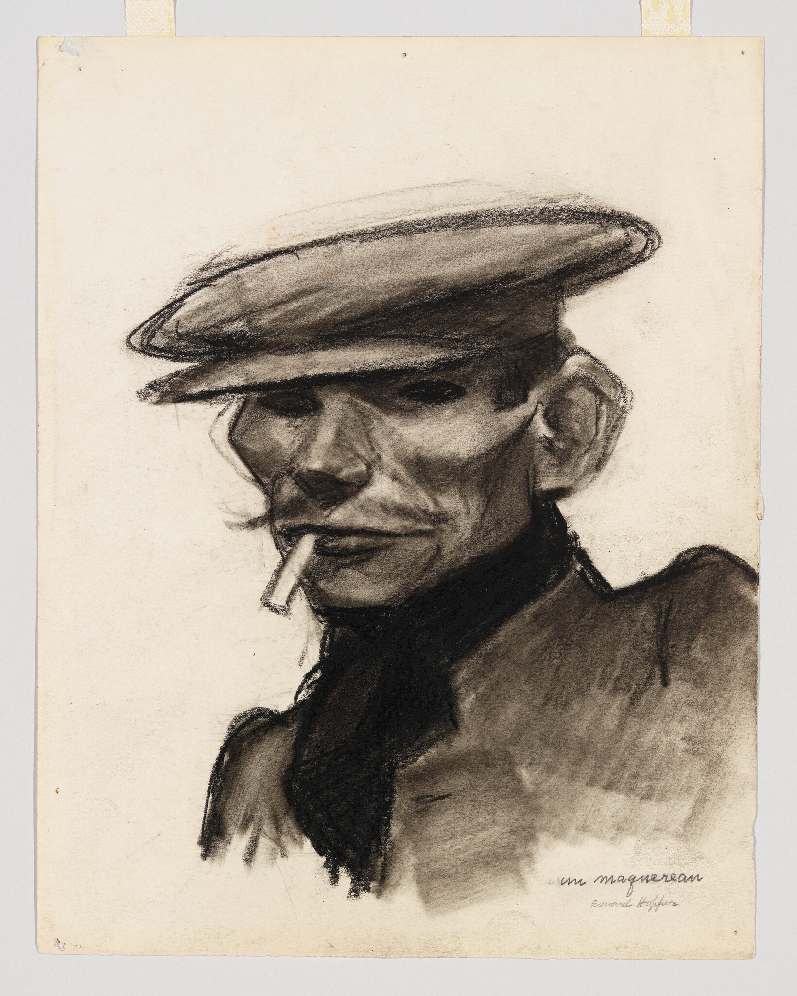 A man wearing a flat cap stares forward with a cigarette between his lips.