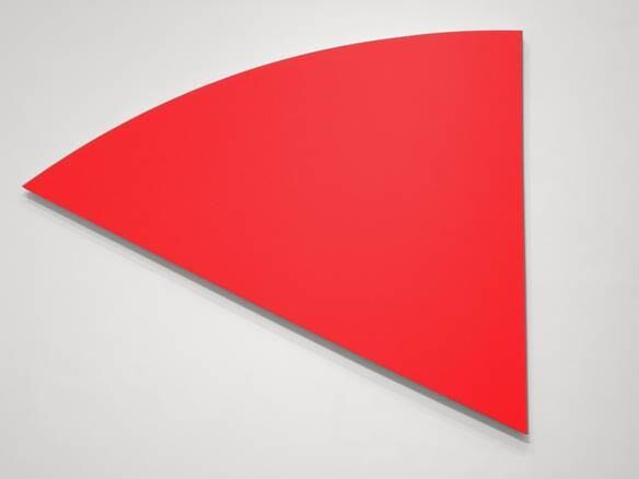 A large, solid red quarter-circle shape is displayed against a plain light gray background.