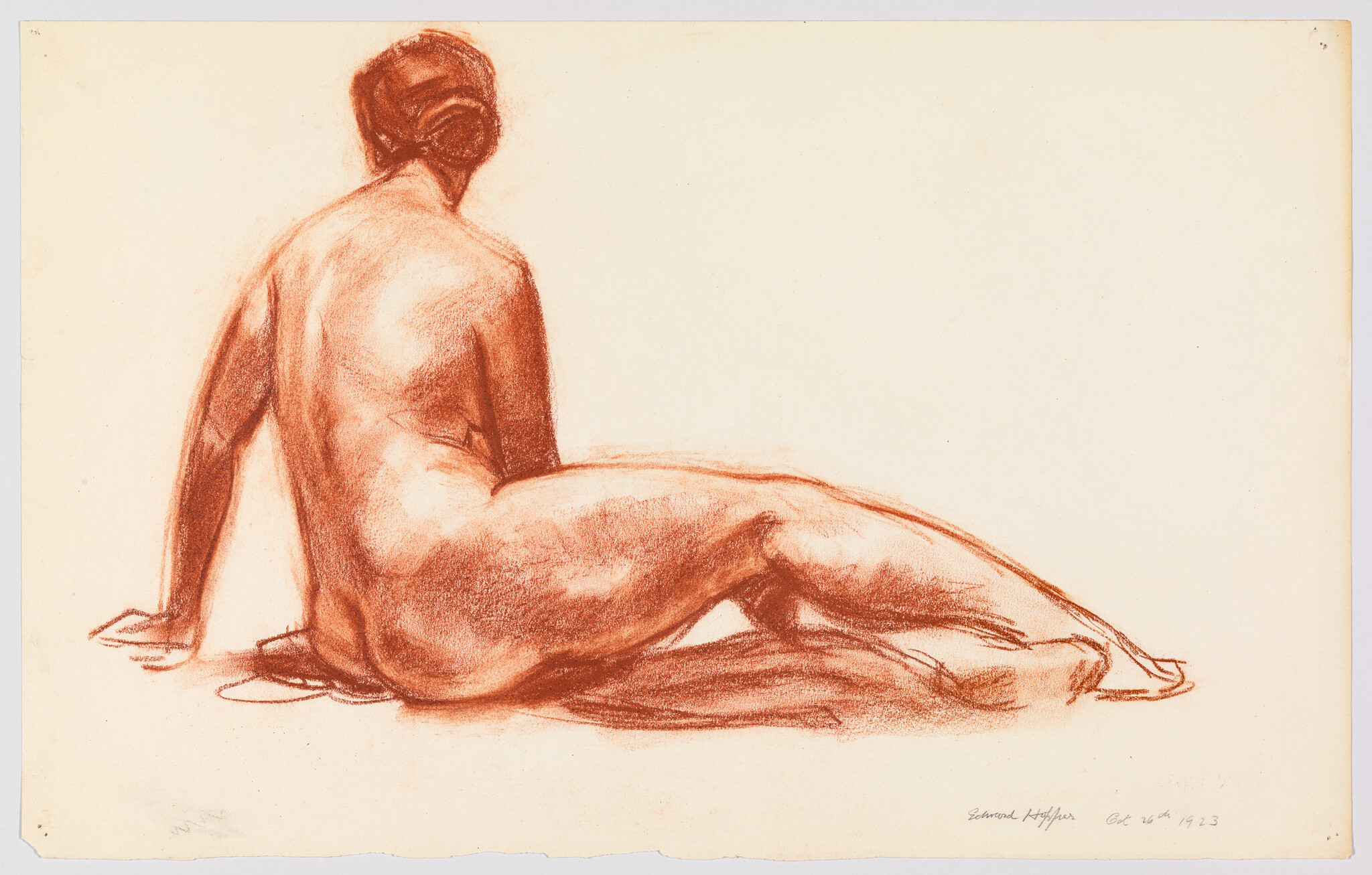 A seated nude woman seen from behind with red chalk shading and relaxed pose.