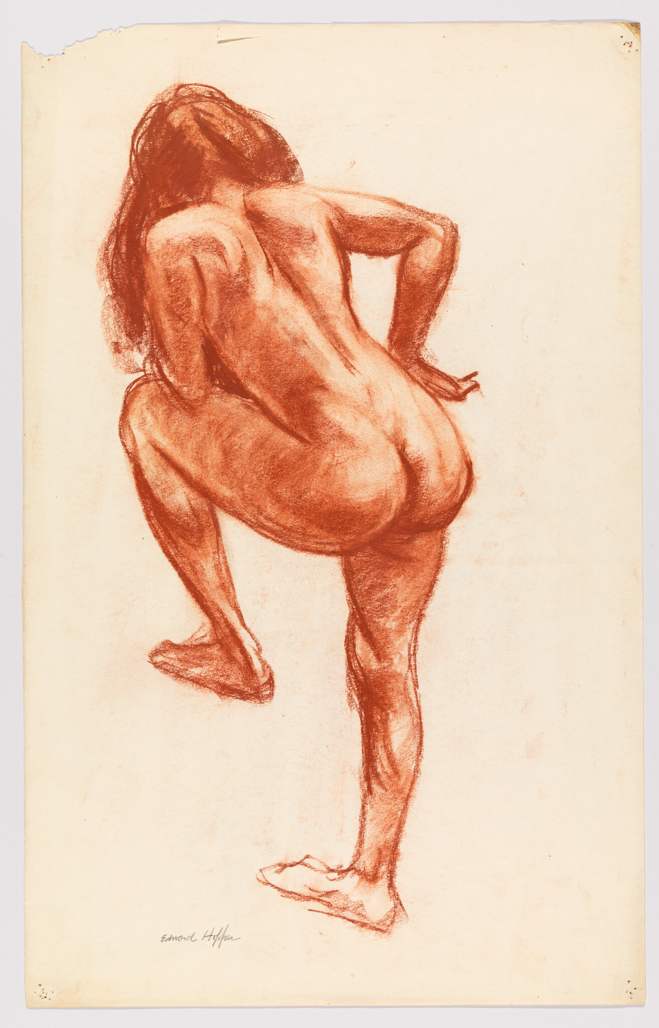 Nude woman seen from the back lifting one leg as she steps upward.