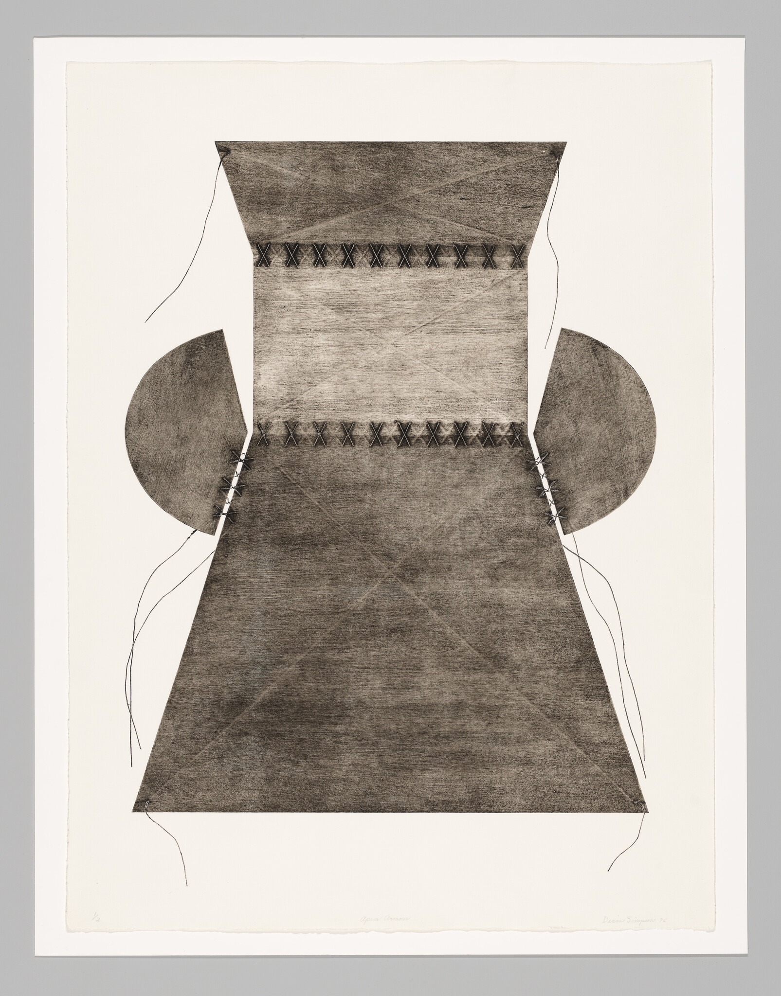 A large stitched trapezoid shape with two semicircles and loose threads on a pale background.