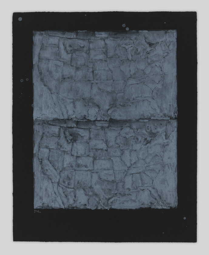 A textured blue-gray rectangular panel with cracked, grid-like patterns centered on a black background.