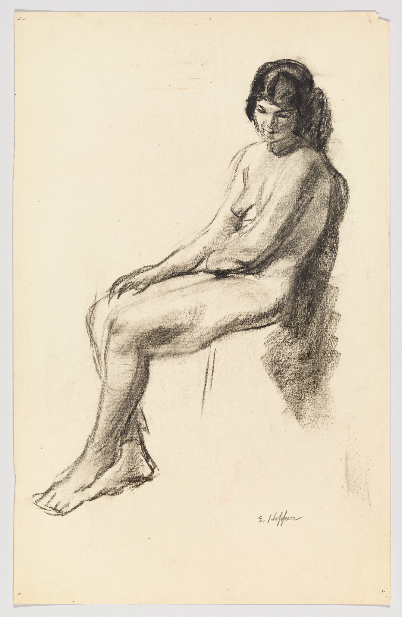 A seated nude woman looks downward while resting her hands on her lap.