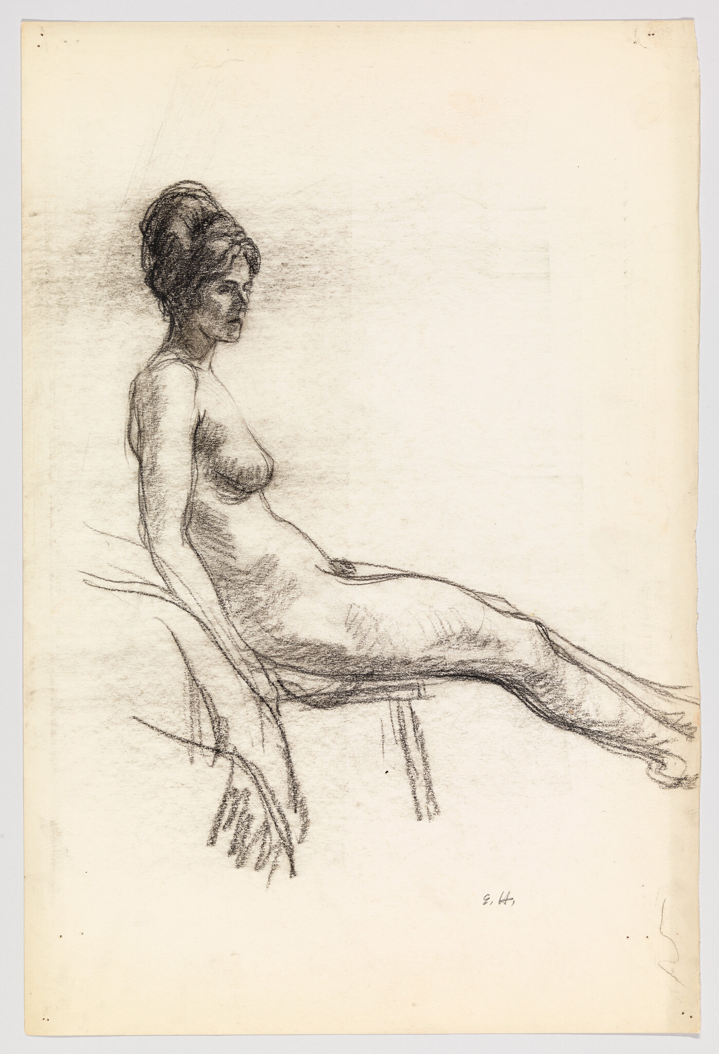 A seated nude woman is drawn in charcoal, reclining slightly with legs extended.