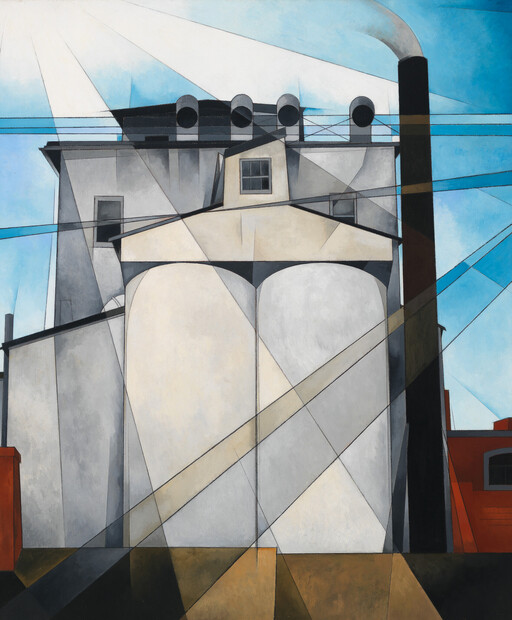 A geometric industrial building with two large silos, a tall smokestack, and crisscrossing power lines.