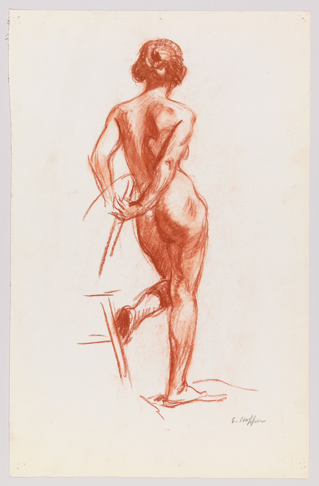 Nude woman standing with one leg bent and hands behind her back in a red chalk sketch.