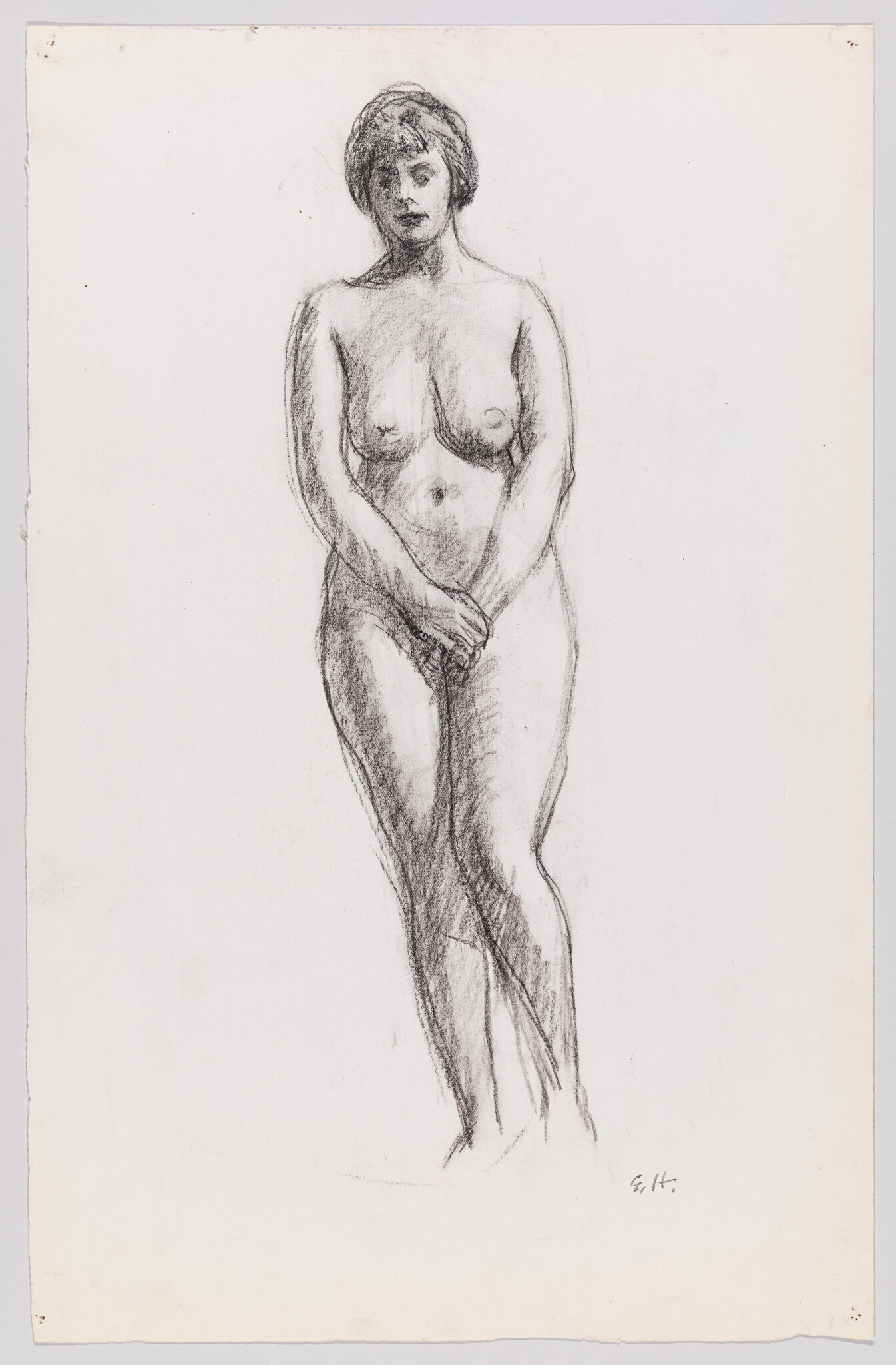 Standing nude woman faces forward with hands clasped modestly over her lower abdomen.