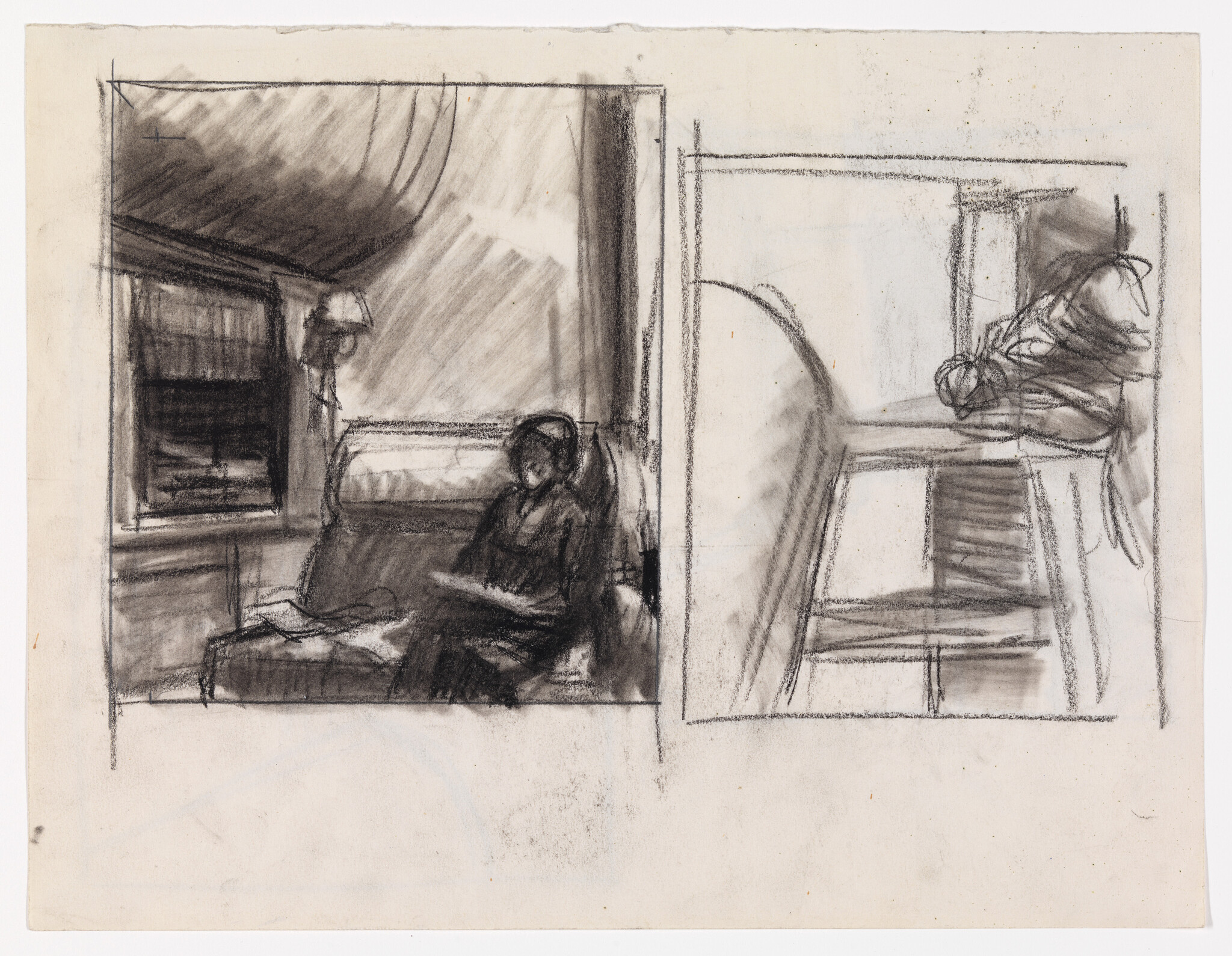 A person sits on a sofa reading in a shaded room while light falls through a window.