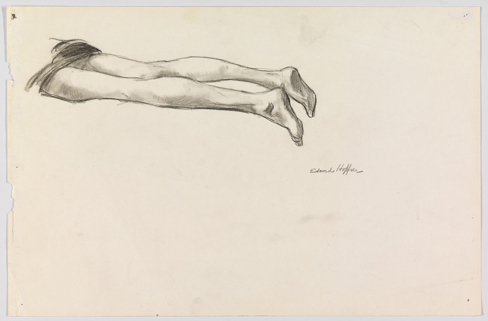 A charcoal sketch showing a pair of extended legs and pointed feet lying horizontally.