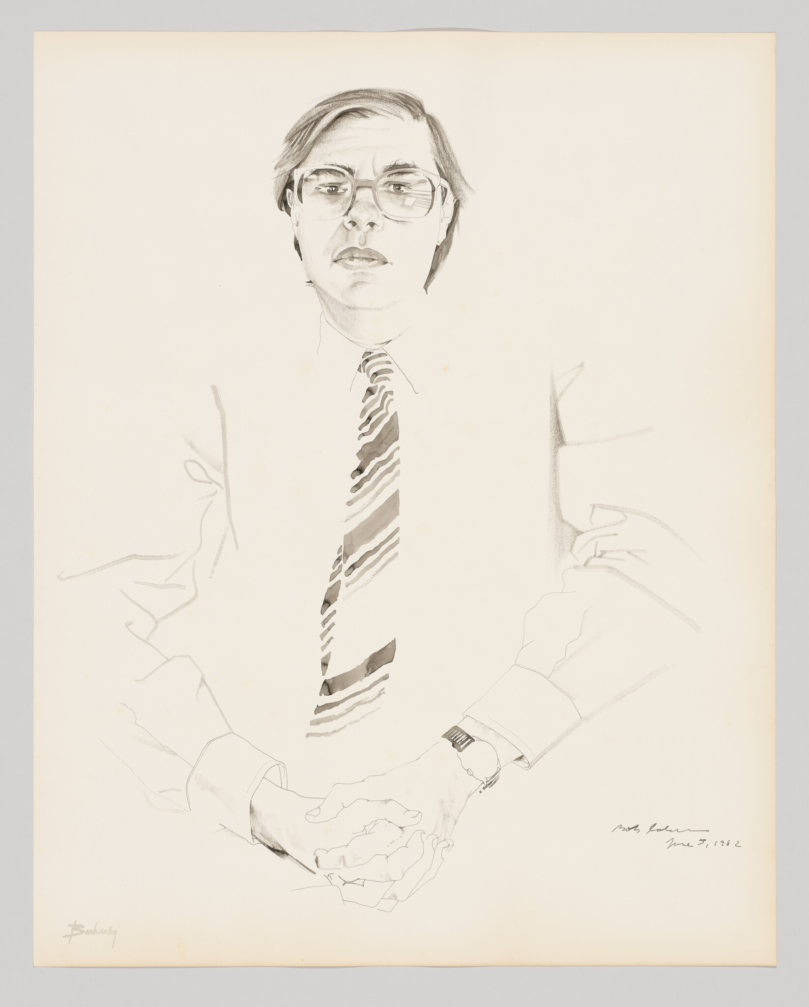 A seated man wearing glasses and a striped tie sits with hands clasped and a wristwatch.