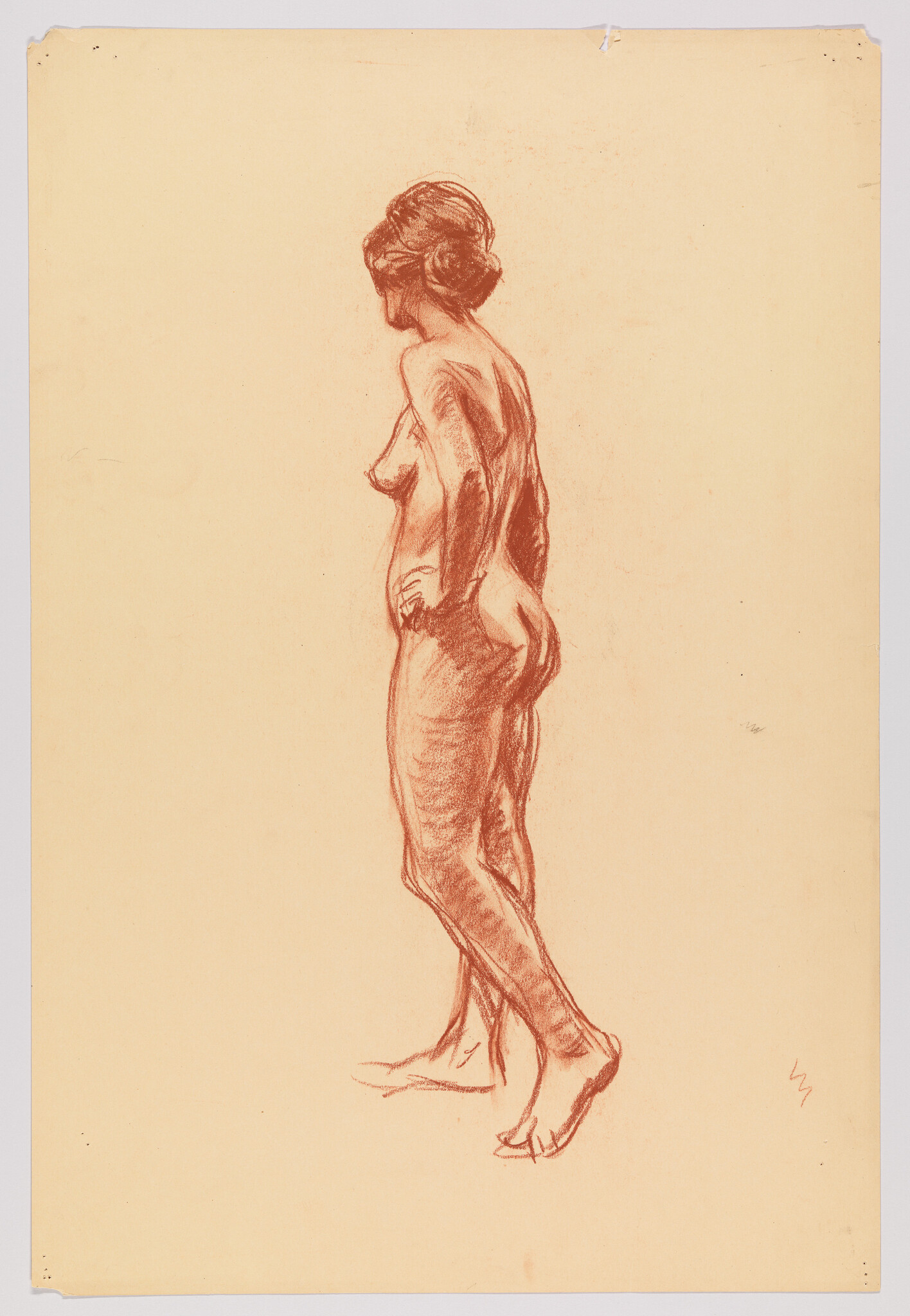 Standing nude woman seen from the side with hands on hips, weight on one leg.