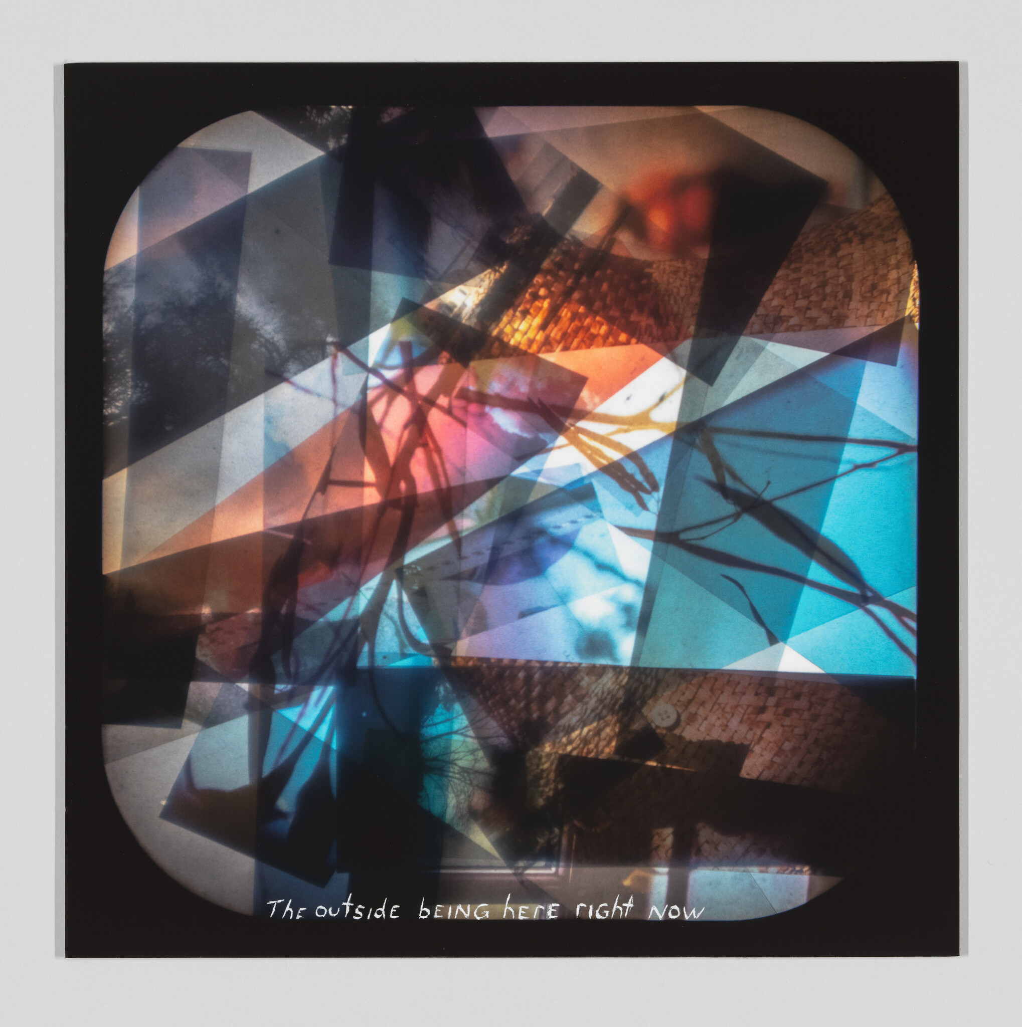 A photograph of a layered and abstract art piece with a mix of geometric shapes and organic forms in various shades of blue, orange, and black. The image includes text at the bottom that reads "The outside being here right now."