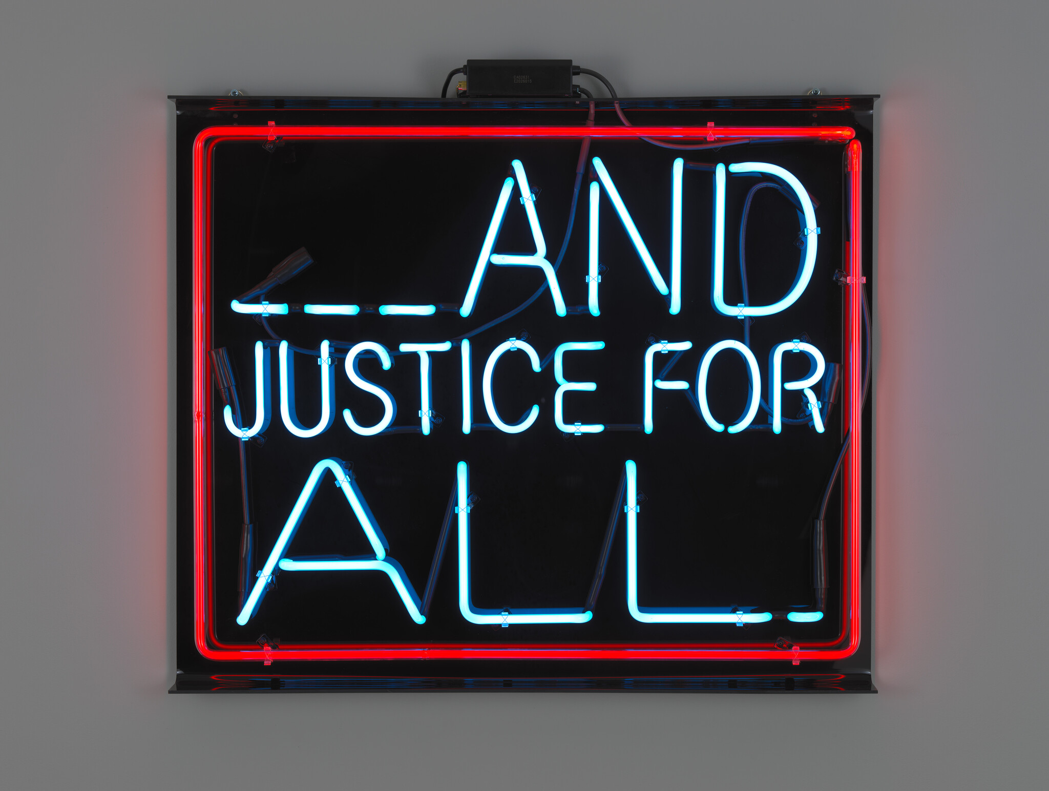 A neon sign glowing blue and red reads the words and justice for all on a black background.