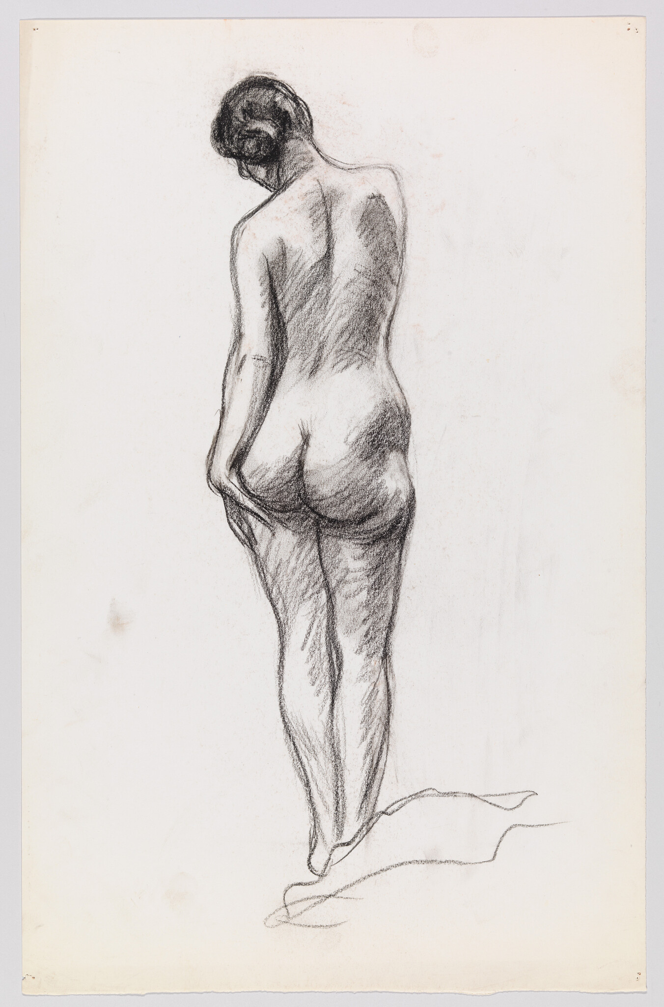 Nude woman standing on tiptoe seen from behind, holding a cloth at her hip.
