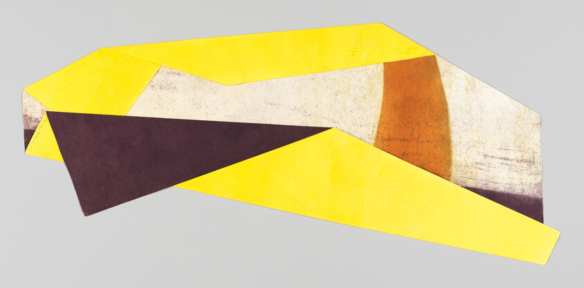 Large abstract geometric shape with yellow and brown folded planes on a light gray background.