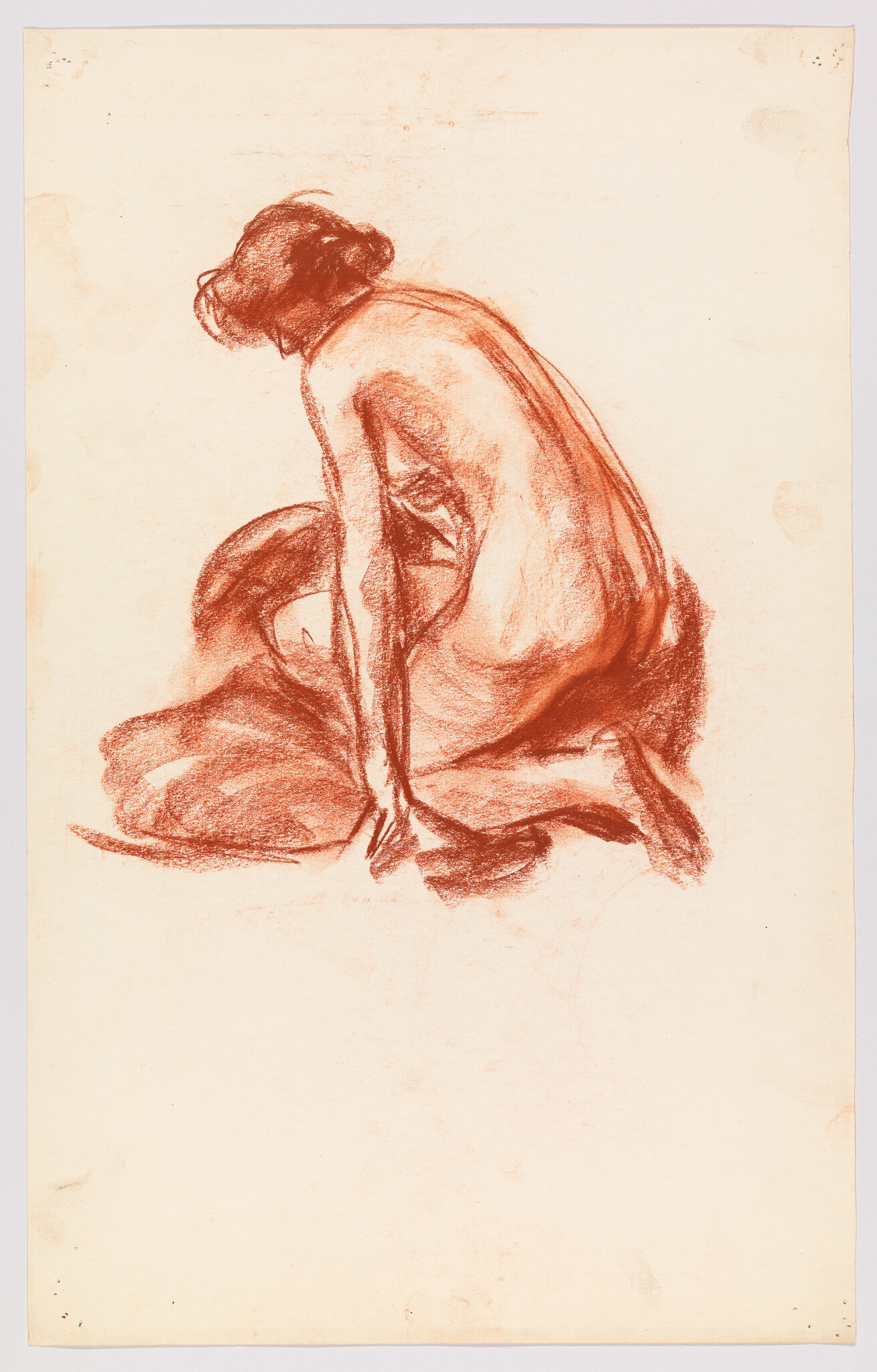 A seated nude woman leans forward with hands resting on the floor.